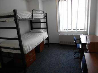 Double Room in the Juilliard Dormitory.  Each room has 2 beds and 2 student desks.